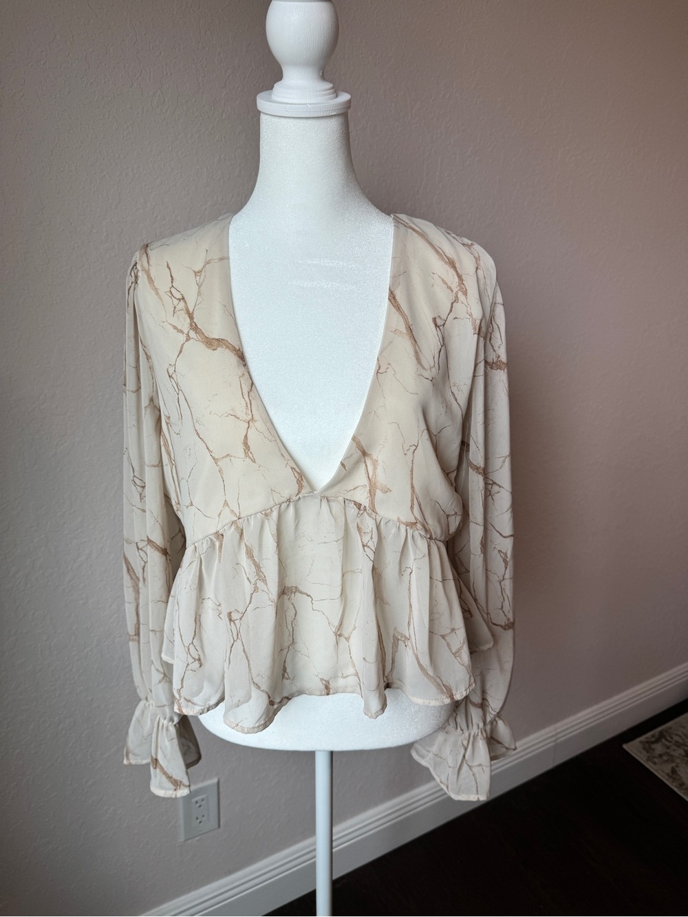 Women's Cream Marble-Print Deep V Peplum Blouse